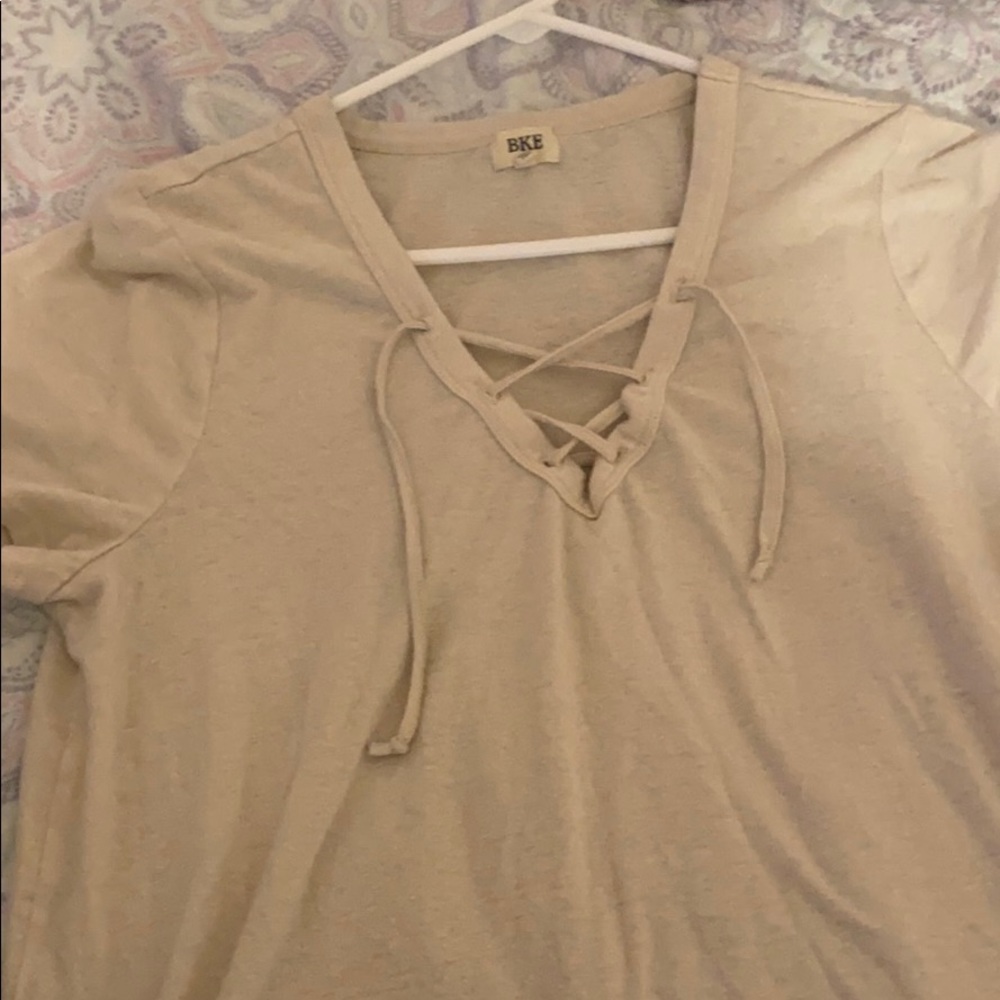 A cream v-neck shirt!